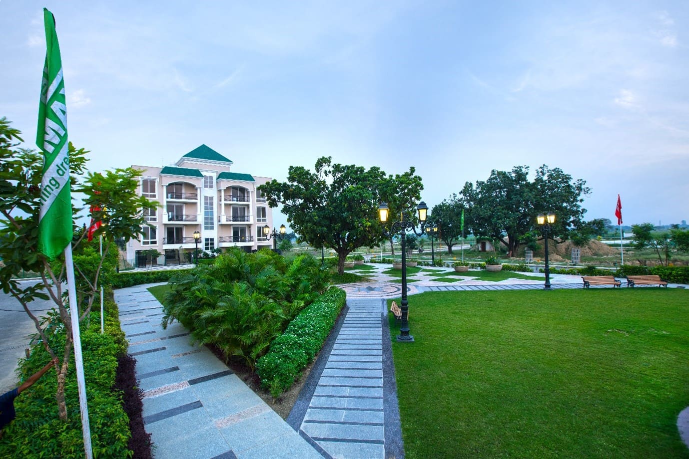 Demarcated residential plot land with wide approach road and green surroundings in Lucknow
